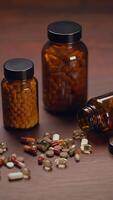 Collection of Various Vitamins and Supplements Displayed in Glass Jars on a Wooden Table video