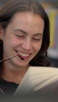 An engaged reader with stylish glasses, deeply immersed in a book, showcasing calm concentration video
