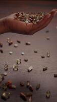 A Handful of Various Capsules and Pills Arranged Beautifully on a Wooden Surface video