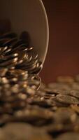 Coins Have Been Spilled from a Container and Spread Out Across the Table Surface Area video