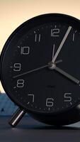Sleek and Minimalist Black Alarm Clock Stylishly Placed on a Desk for Modern Aesthetics video