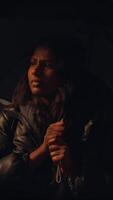 A woman with an umbrella stands in a dark, moody setting that evokes deep feelings video