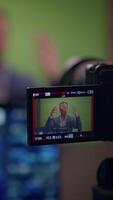 A Person is Recording a Speech on a Green Screen for the Purpose of Content Creation video