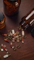 A Variety of Assorted Pills and Capsules Displayed Organized on a Wooden Surface video
