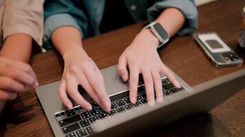 Collaborative Workspace. Hands typing on laptop keyboard, teamwork concept video