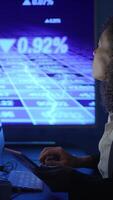 A Focused Analyst is Actively Engaged in Reviewing Stock Market Trends and Analyzing Data video