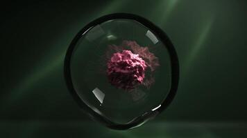 A pink cell structure with a rough surface, featuring thin, flexible, tentacle-like appendages resembling a virus, floating inside a transparent spherical bubble against a green background video