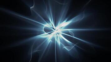 Looped animation of ethereal energy burst with soft shine effect on a black background. Astral light source screensaver for abstract art performance and spiritual visualization. VJ loop 4K 60fps video