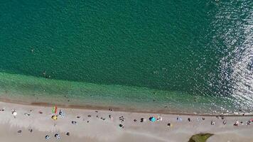 Panoramic Drone View of Clear Sea, Tourist Beach, and Yachts in Open Water video