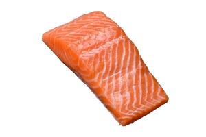 Fresh raw salmon steak with spices and herbs photo