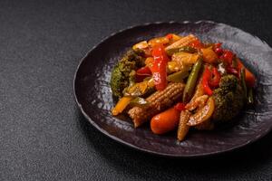 Mix of vegetables corn, carrots, peppers, broccoli, onions in teriyaki sauce photo