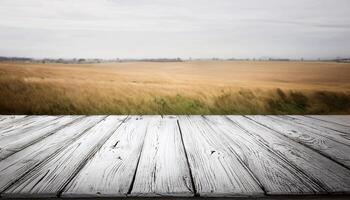 Rustic White Wooden Tabletop Over Golden Wheat Field Landscape photo