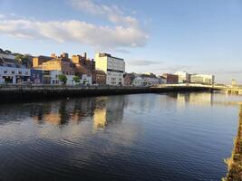 Waterfront Building with Azure Sky and Clouds at Dusk photo