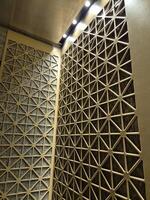 Abstract pattern wall in a hotel elevator, geometric shapes photo