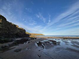 Coastal Landscape at Dusk with Water and Mountains photo