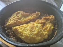Fresh Ingredients for Cooking a Recipe in a Bowl with Cookware and Bakeware photo