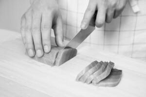 Person preparing sashimi photo