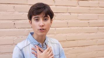 A Youthful and Vibrant Expression of Genuine Emotion Set Against a Neutral Background video