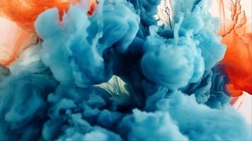 Abstract Ink Swirl. A mesmerizing abstract image of blue and orange ink swirling and merging, creating a vibrant and dynamic composition. The colors dance and blend seamlessly.. video