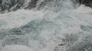 Close-up of churning water in rapid motion video