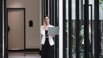 Businesswoman in glasses with during coffee break in modern office with panoramic windows. Networking and discussion, share ideas at conference. Digital marketing and brainstorming. video