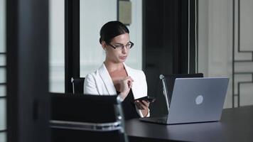 Businesswoman using computer to analyze cryptocurrency trading. Investor broker work online, discussing dynamic stock market with client comparing real-time, currency rate, investment in modern office video