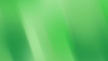 Green gradient background with light streaks and specks, suitable for presentations, websites, or digital artwork requiring a subtle design. video