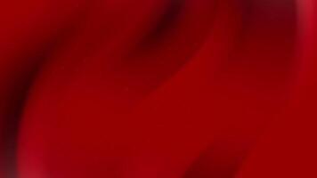 Red fabric curves softly, showing gentle texture. Suitable for backgrounds, design elements, or as a backdrop for various creative projects. video