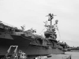Navy Battle Ship With Guns and Other Weapons Background photo