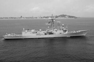 Navy Battle Ship With Guns and Other Weapons Background photo