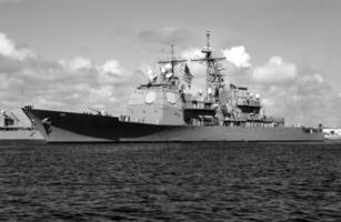 Navy Battle Ship With Guns and Other Weapons Background photo