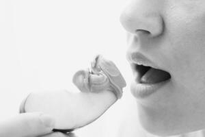 Woman Eating Apple with Peanut Butter photo