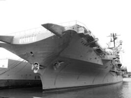 Navy Battle Ship With Guns and Other Weapons Background photo