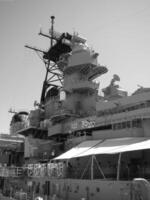 Navy Battle Ship With Guns and Other Weapons Background photo