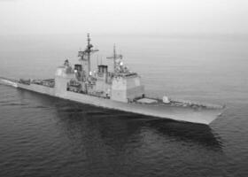 Navy Battle Ship With Guns and Other Weapons Background photo