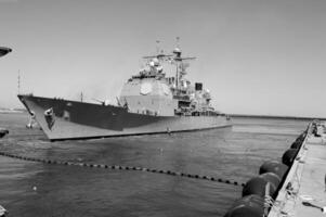 Navy Battle Ship With Guns and Other Weapons Background photo