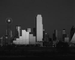 Dusk Cityscape Skyscrapers and Tower Blocks Under a Cloudy Sky photo