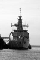 Navy Battle Ship With Guns and Other Weapons Background photo