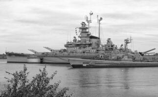 Navy Battle Ship With Guns and Other Weapons Background photo