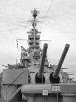 Navy Battle Ship With Guns and Other Weapons Background photo