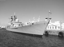 Navy Battle Ship With Guns and Other Weapons Background photo