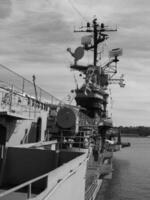 Navy Battle Ship With Guns and Other Weapons Background photo