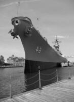 Navy Battle Ship With Guns and Other Weapons Background photo