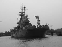 Navy Battle Ship With Guns and Other Weapons Background photo