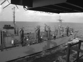 Navy Battle Ship With Guns and Other Weapons Background photo