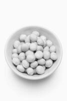 Roasted Macadamia Nuts in White Bowl photo