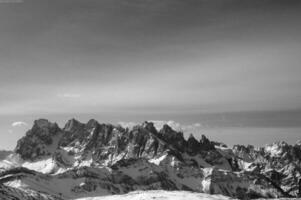 Snowy Mountain Landscape with Clouds in the Sky photo