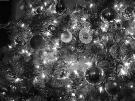 Christmas Tree Decoration with Gold Ornaments and Lights photo