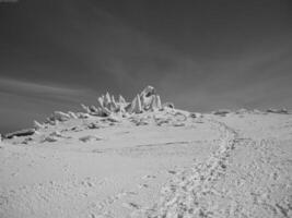 Mountain Landscape with Snow, Ice Cap, and Cloudy Sky photo