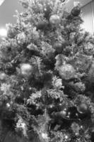 Christmas Tree with Ornaments and Evergreen Branches photo